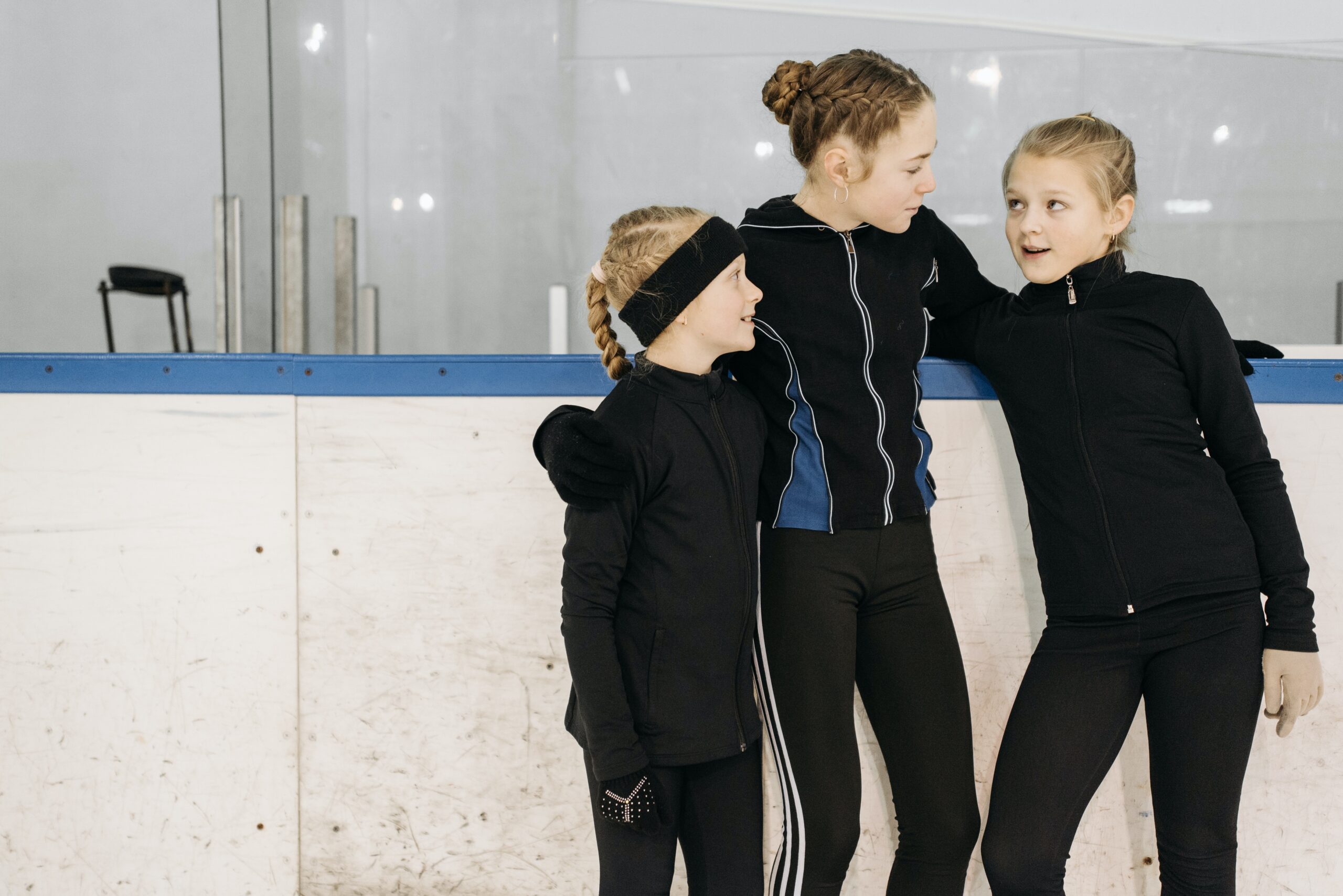 three young girls talking